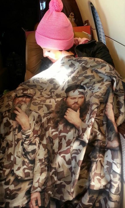 From Sarah Palin's facebook page. One of the Palin Clan wraps themself on a private plane in a Duck Dynasty blanket.